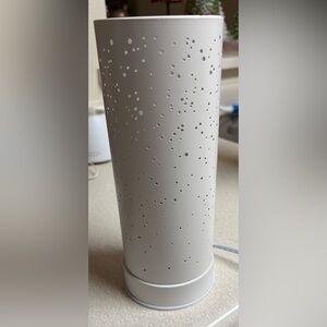 Saje candlelight diffuser. Put oils and plug in has a soft glow